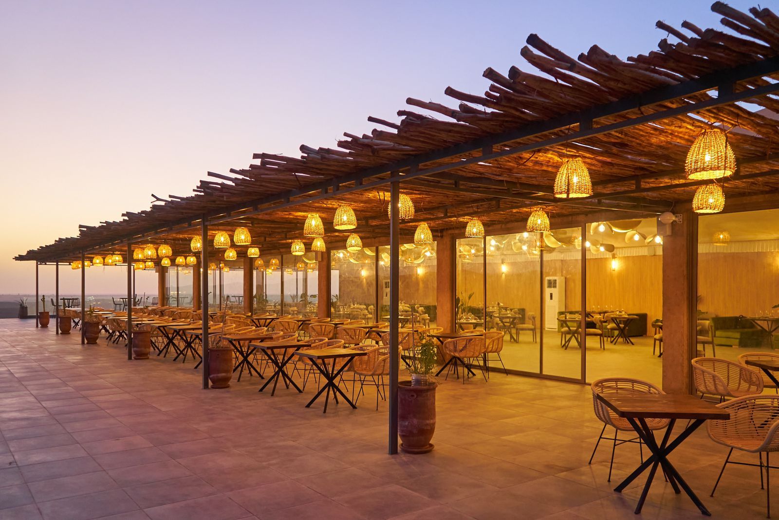 Shaded restaurant terrace looking out over the Agafay Desert